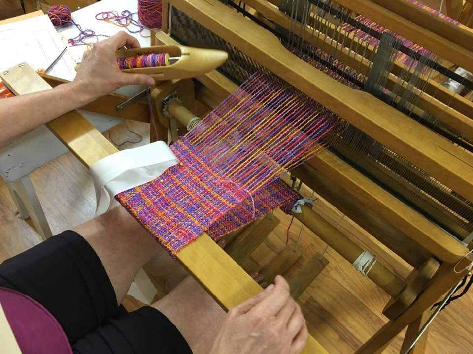 weaving on a floor loom
